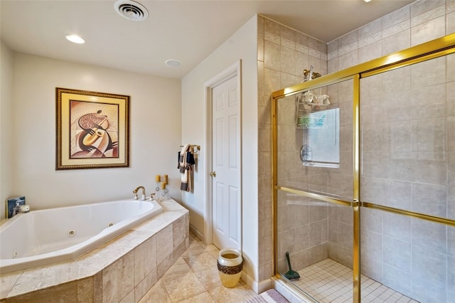 bathroom with separate shower and tub and tile patterned floors