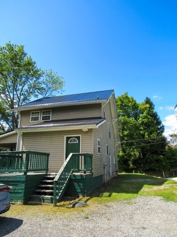 view of front facade with a wooden deck