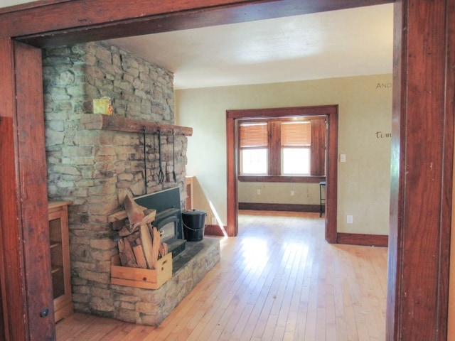 living room with a fireplace and light hardwood / wood-style flooring