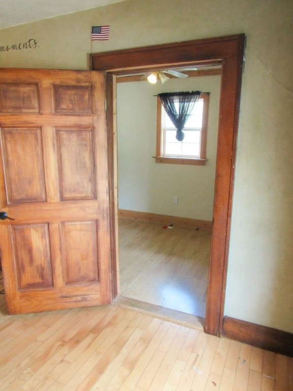 interior space with light hardwood / wood-style flooring and lofted ceiling