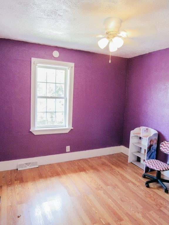 interior space featuring ceiling fan and light hardwood / wood-style floors