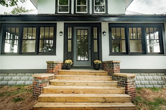 property entrance featuring metal roof