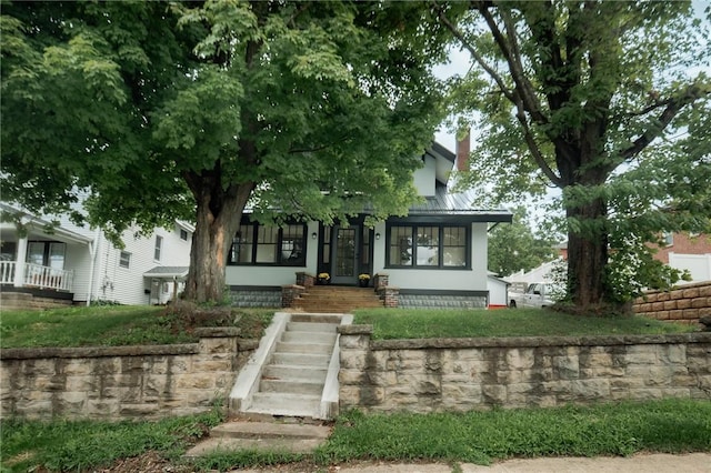 view of front of property featuring metal roof