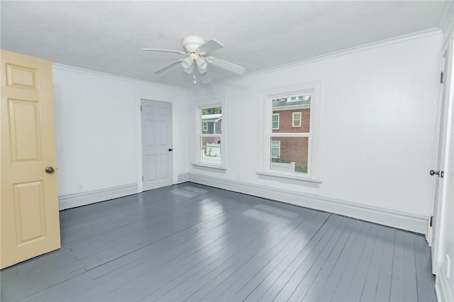 unfurnished room with dark wood-type flooring, crown molding, baseboards, and ceiling fan