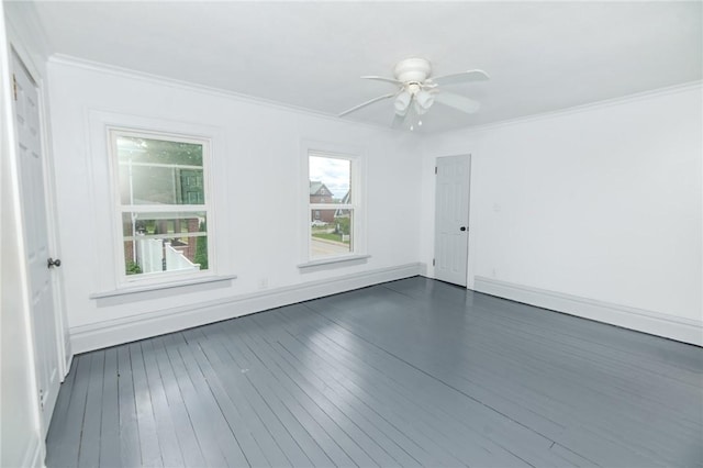 unfurnished room with ceiling fan, baseboards, dark wood-style flooring, and crown molding