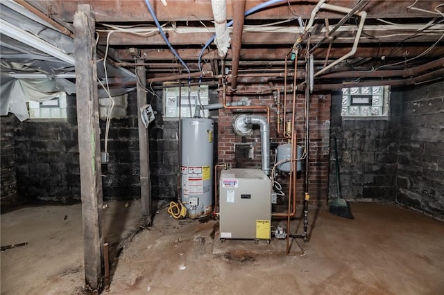 utility room featuring a heating unit and gas water heater