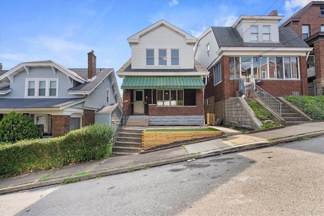 view of front of house featuring brick siding