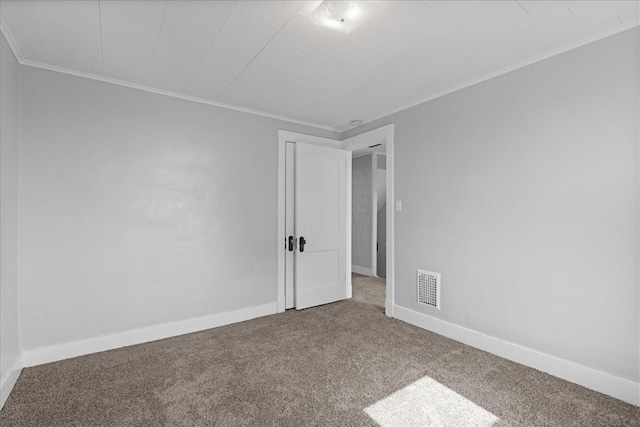 unfurnished room featuring carpet and crown molding