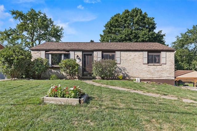 ranch-style house featuring a front lawn