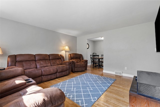 living room with wood-type flooring