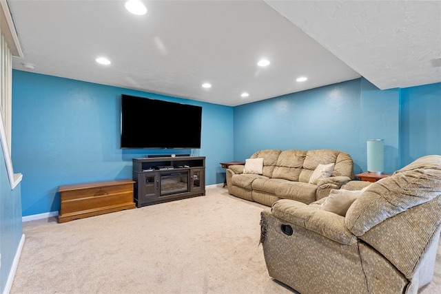 carpeted living room featuring a fireplace