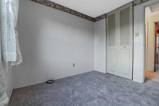 unfurnished bedroom with carpet floors