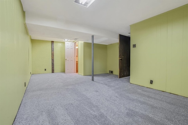 basement with light colored carpet