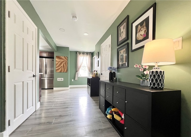 hall featuring light hardwood / wood-style floors