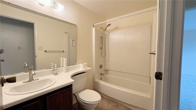 full bathroom featuring tile patterned flooring, toilet, tub / shower combination, and vanity