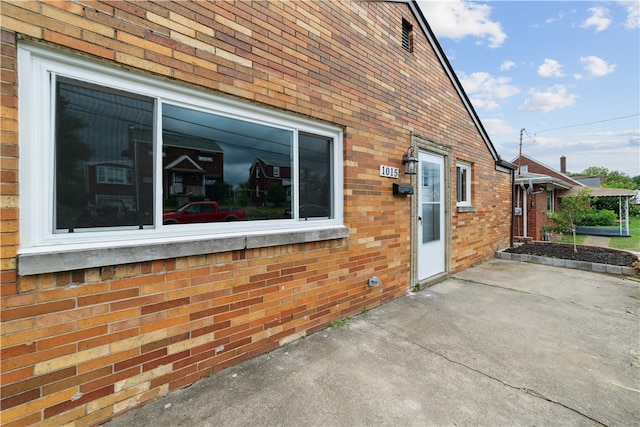 view of side of home with a patio area