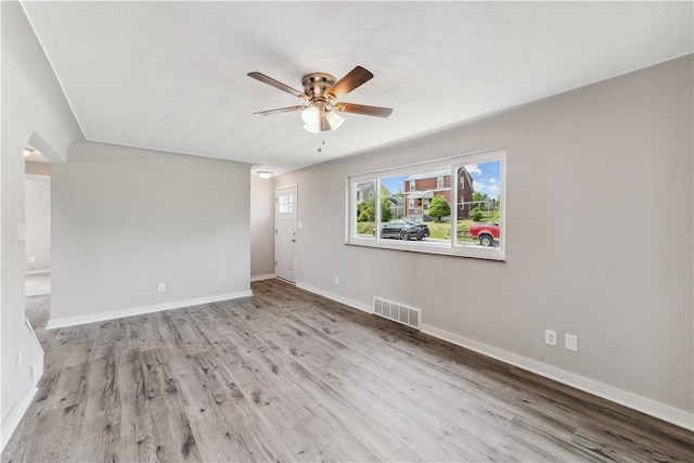 spare room featuring ceiling fan and light hardwood / wood-style floors