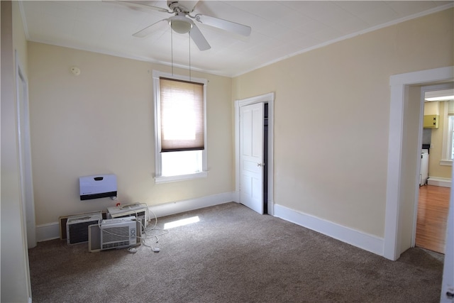 interior space with ceiling fan, crown molding, and carpet flooring