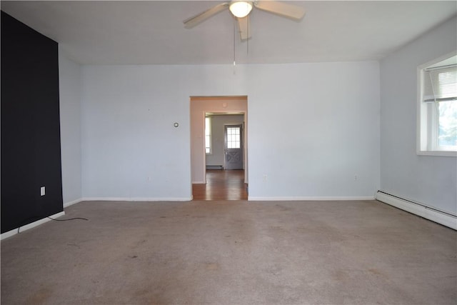 unfurnished room featuring a baseboard heating unit, carpet floors, a ceiling fan, baseboards, and baseboard heating