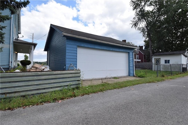 detached garage with fence