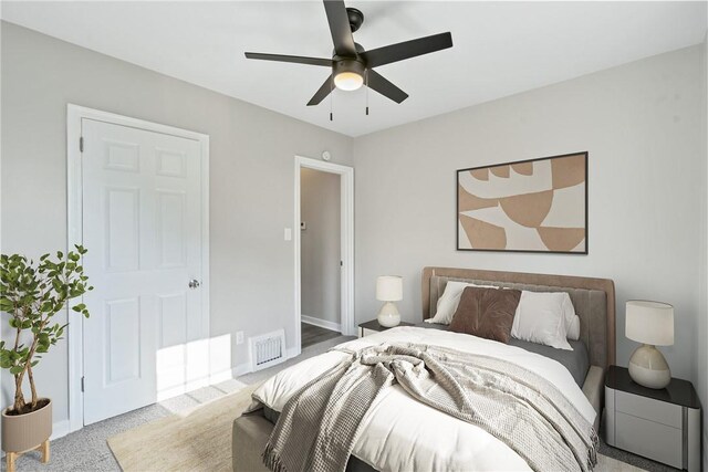 carpeted bedroom featuring ceiling fan