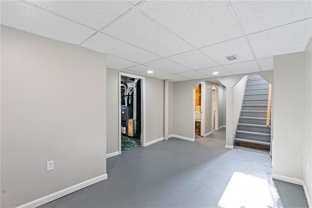 basement featuring a paneled ceiling