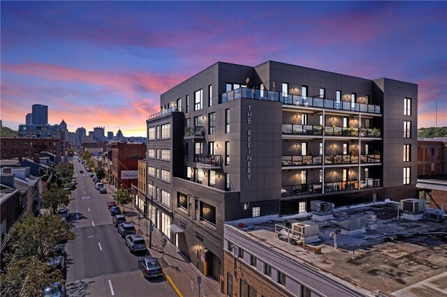 view of outdoor building at dusk