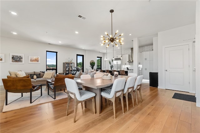 dining room featuring a chandelier, recessed lighting, visible vents, and light wood-style floors