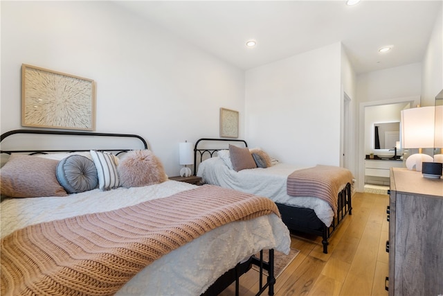 bedroom featuring light wood-style flooring and recessed lighting