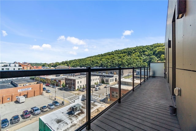 balcony featuring central AC and a city view