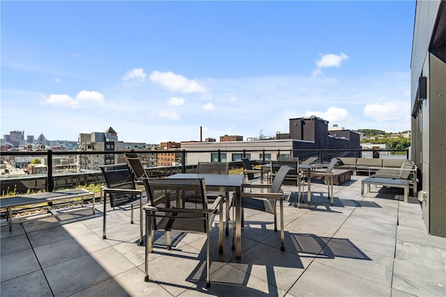 view of patio / terrace featuring a city view