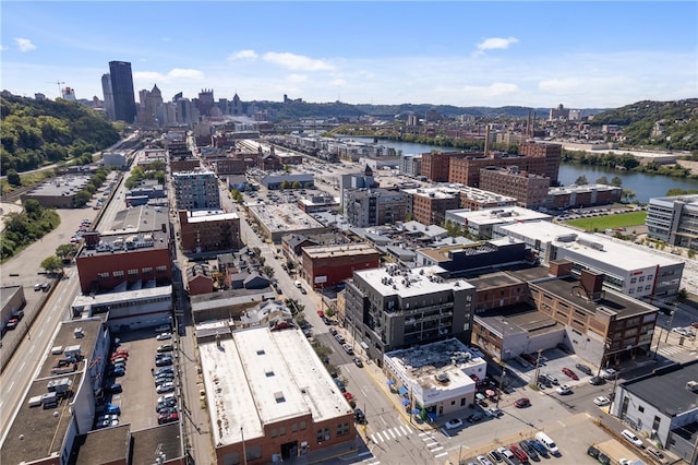 birds eye view of property featuring a view of city and a water view