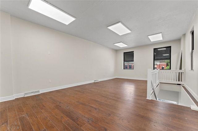 empty room featuring hardwood / wood-style flooring