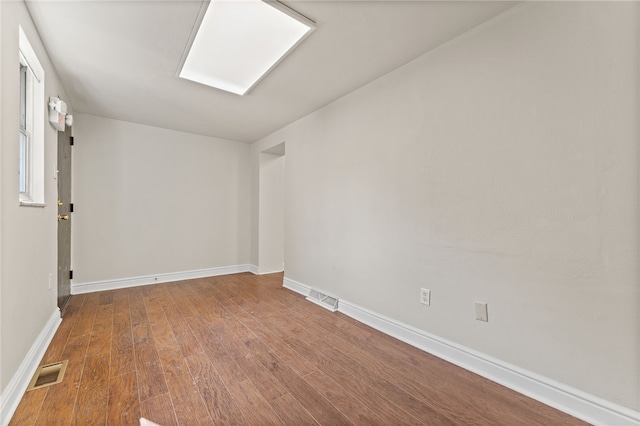 empty room featuring hardwood / wood-style flooring