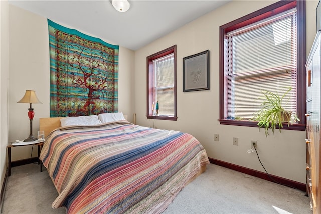 bedroom with light carpet