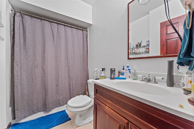 bathroom featuring tile patterned flooring, vanity, and toilet