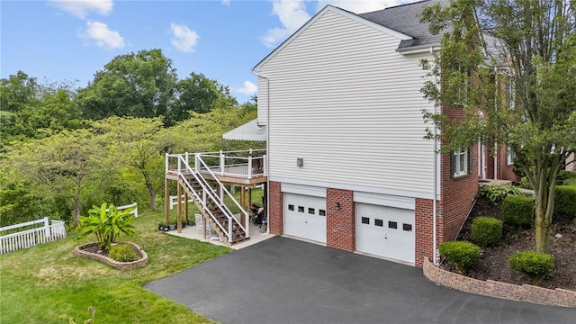 view of property exterior featuring a garage and a lawn