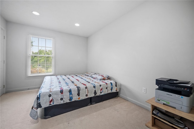 bedroom with light carpet