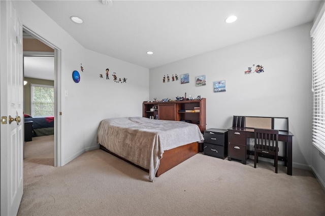 bedroom with light carpet