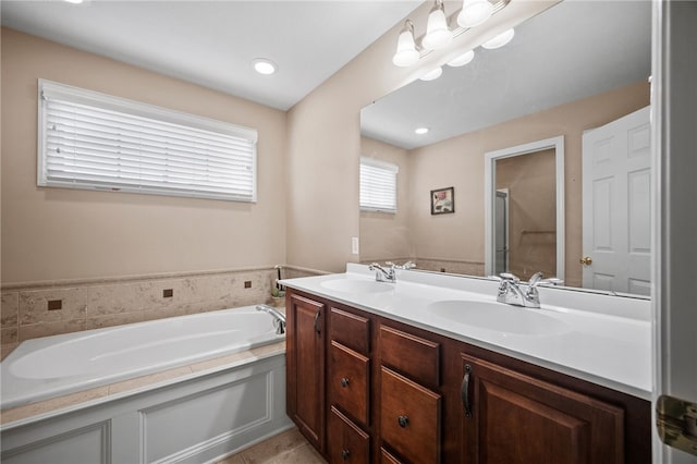 bathroom with vanity, shower with separate bathtub, and tile patterned flooring