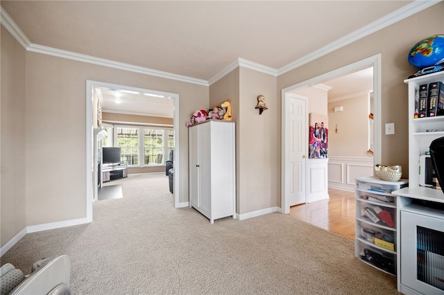 interior space with ornamental molding and light colored carpet