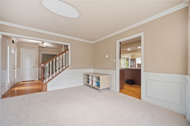 interior space featuring crown molding, built in desk, and carpet