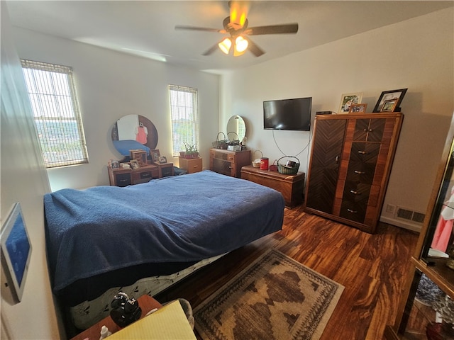 bedroom featuring ceiling fan and dark hardwood / wood-style flooring