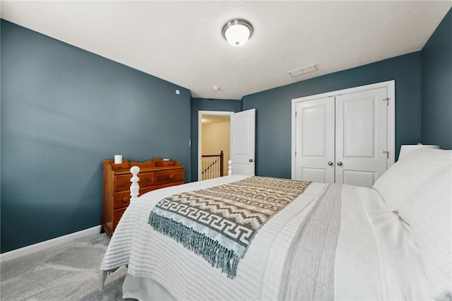 bedroom with a closet and carpet flooring