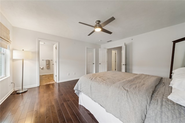 bedroom featuring ceiling fan, dark tile patterned flooring, and ensuite bathroom