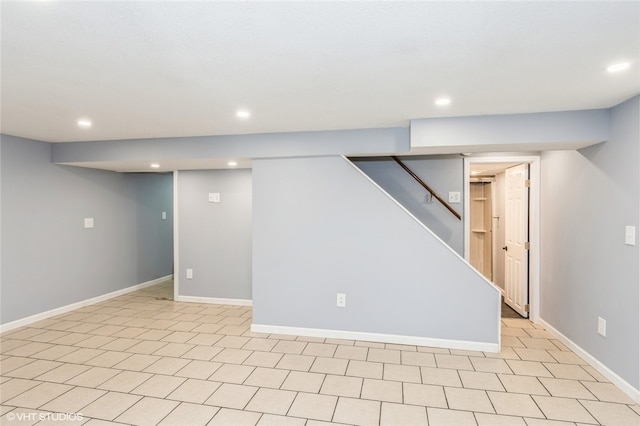 basement with light tile patterned flooring