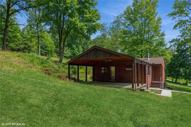 exterior space with a patio and a yard