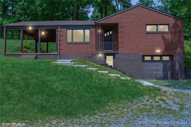 view of front facade with a front yard and a garage