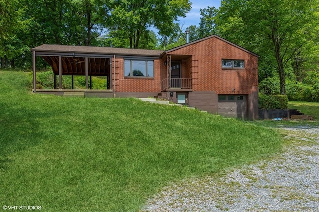 view of front facade with a garage and a front lawn