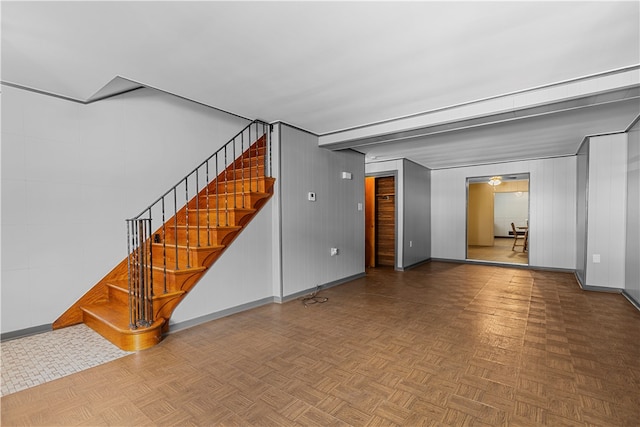 unfurnished living room with parquet floors